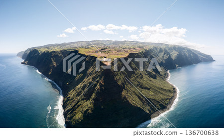 Wide drone view of Ponta do Pargo, Madeira Portugal, wave lines trace the base of sheer cliffs 136700638