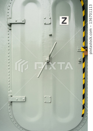 Heavy-duty metal hatch on a military vessel with secure locking system 136701113