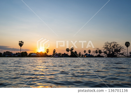 Sunset over floating Bugis fishermen village, Lake Tempe, Sulawesi, Indonesia Sunset over floating Bugis fishermen village, Lake Tempe, Sulawesi, Indonesia 136701136