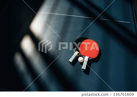 Top view. Two rackets and ball on the tennis table Top view. Two rackets and ball on the tennis table 136701609