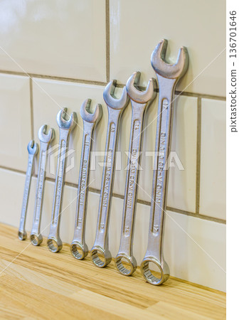 A complete set of chrome-vanadium combination spanners arranged in ascending order of size. Essential tools for mechanics and DIY.. High quality photo 136701646