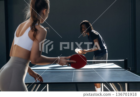 Active lifestyle. Tennis game, man and woman are indoors 136701918