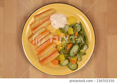 Baked Surimi Sticks with Boiled Vegetables on a Plate Baked Surimi Sticks with Boiled Vegetables on a Plate 136702330