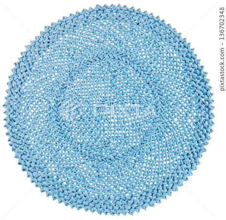 A blue woven coaster with a jagged edge cut out on a white background A blue woven coaster with a jagged edge cut out on a white background 136702348