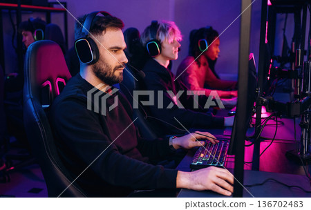 Competition conception. Gamers are playing video game by computers 136702483
