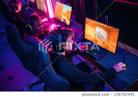Shooter game. People are playing video game by computers Shooter game. People are playing video game by computers 136702495