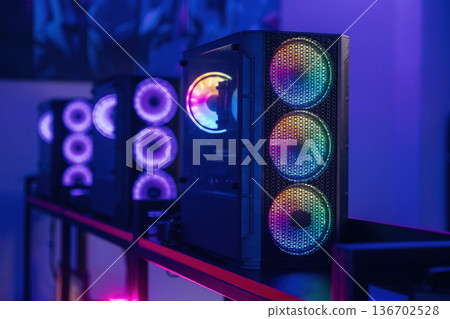 Gaming computer is in the dark room with neon lighting Gaming computer is in the dark room with neon lighting 136702528