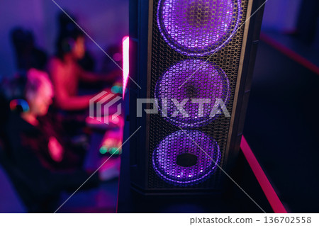 Powerful cooling system. Gamers are playing video game by computers Powerful cooling system. Gamers are playing video game by computers 136702558