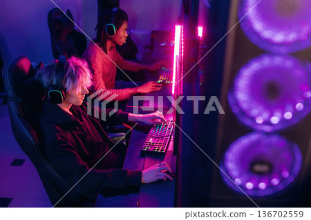 Powerful cooling system. Gamers are playing video game by computers Powerful cooling system. Gamers are playing video game by computers 136702559