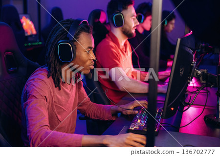 High end PC's, side view. Gamers are playing video game by computers 136702777