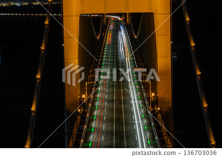 The golden Seto Ohashi Bridge rising from the silent sea The golden Seto Ohashi Bridge rising from the silent sea 136703036