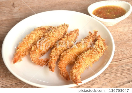 crispy fried shrimp coating flake bread and flour or tempura Japanese food on plate dipping spicy and sour seafood chili sauce 136703047
