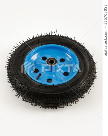 Wheel is pneumatic on a white background. Black rubber, blue disc. Wheel is pneumatic on a white background. Black rubber, blue disc. 136703053