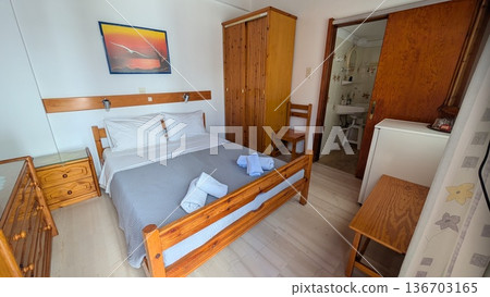 Guest room with a king bed, mini refrigerator, drawers Guest room with a king bed, mini refrigerator, drawers 136703165