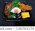 A great value mini rice ball and fried soba bento from the supermarket 136703174