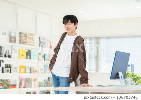 Young male engineer working in the office Young male engineer working in the office 136703746