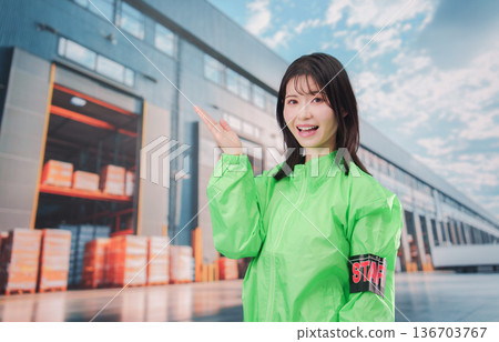 Staff guiding customers at the logistics center 136703767