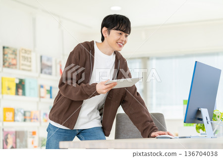 Young male engineer working in the office Young male engineer working in the office 136704038