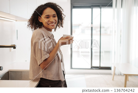 Bright Woman Relaxing By Window With Coffee, Joyful Woman In Sunny Apartment Holding Warm Beverage Bright Woman Relaxing By Window With Coffee, Joyful Woman In Sunny Apartment Holding Warm Beverage 136704242