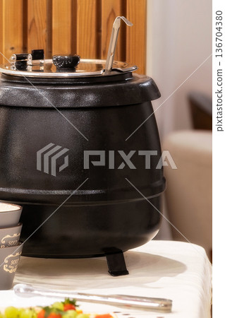 Black soup kettle pot for catering buffet 136704380