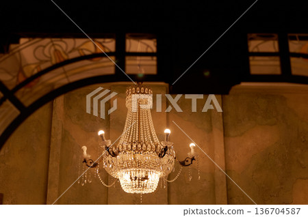 Heavy volumetric crystal chandelier. Palace interiors, Luxury Heavy volumetric crystal chandelier. Palace interiors, Luxury 136704587