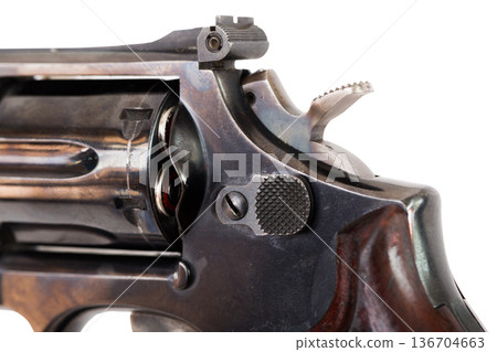Closeup view of loaded revolver with cocked hammer 136704663
