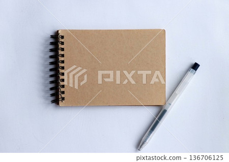 Kraft notebook and pen on white background Simple memo, business, study image Kraft notebook and pen on white background Simple memo, business, study image 136706125