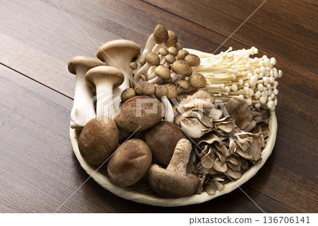 Assorted mushrooms in a colander 136706141