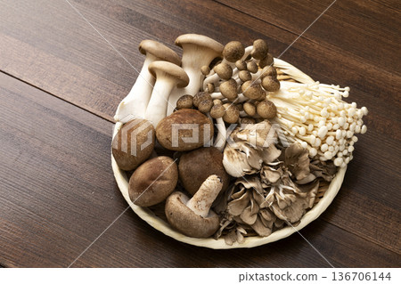 Assorted mushrooms in a colander Assorted mushrooms in a colander 136706144