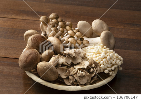 Assorted mushrooms in a colander 136706147