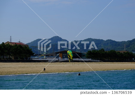 People enjoying kitesurfing 136706539