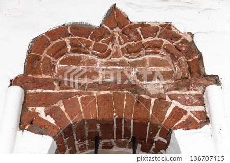 Historic decorative red brick arch 136707415