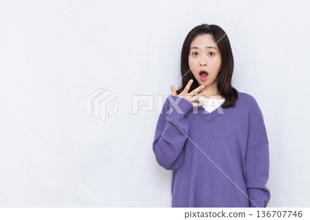 Surprised and amazed woman Surprised and amazed woman 136707746