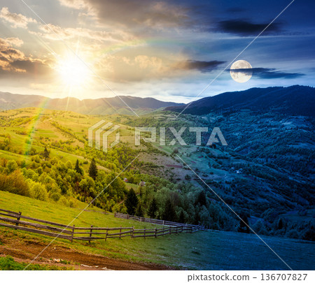 rolling hills of rural landscape in green grass. day and night time change concept. wooden fence in mountains with sun and moon. alpine countryside in spring. duality and transition template rolling hills of rural landscape in green grass. day and night time change concept. wooden fence in mountains with sun and moon. alpine countryside in spring. duality and transition template 136707827