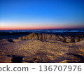 Snow and ice formations and sunset on the Baltic Sea coast 136707976