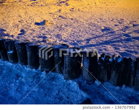 Wooden breakwaters in ice and snow in the Baltic Sea Wooden breakwaters in ice and snow in the Baltic Sea 136707992