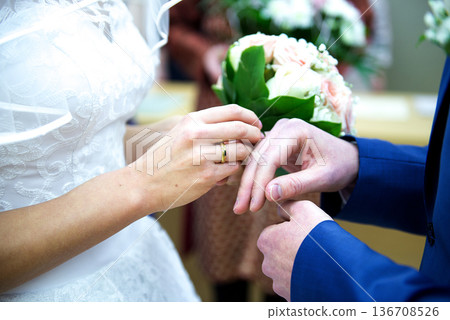 Exchanging Wedding Rings During Marriage Ceremony 136708526