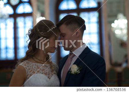 Romantic Wedding Couple Forehead Touching Indoors Romantic Wedding Couple Forehead Touching Indoors 136708536