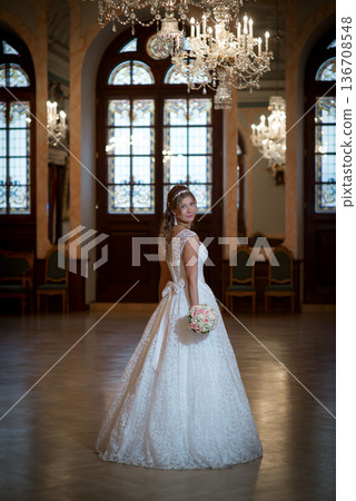 Romantic Bridal Portrait Beneath Crystal Chandeliers Romantic Bridal Portrait Beneath Crystal Chandeliers 136708548