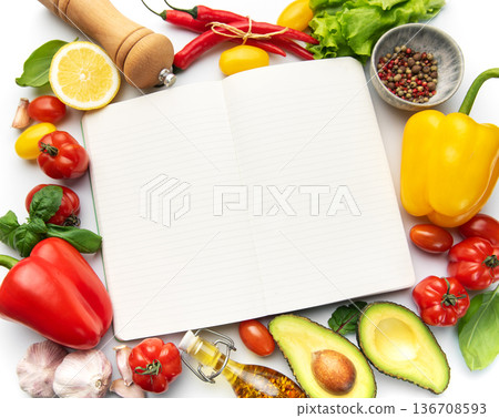 Open notebook with fresh cooking ingredients 136708593