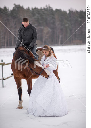 Playful Horse Steals Bride Dress In Snow 136708704