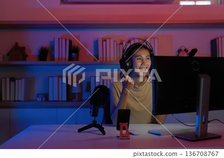 Joyful Gamer Engaging in Online Competition 136708767