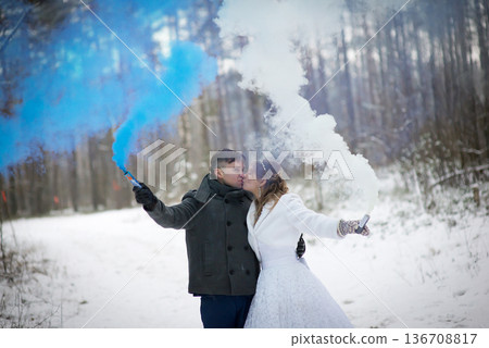 Romantic Wedding Kiss Surrounded By Blue And White Smoke Romantic Wedding Kiss Surrounded By Blue And White Smoke 136708817