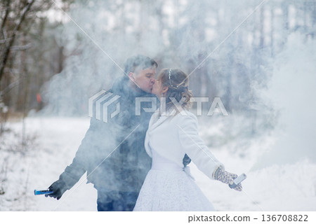 Romantic Winter Kiss With Smoke Flares In Forest Romantic Winter Kiss With Smoke Flares In Forest 136708822