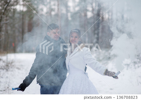 Bride Smiling Through Winter Smoke During Outdoor Wedding Bride Smiling Through Winter Smoke During Outdoor Wedding 136708823
