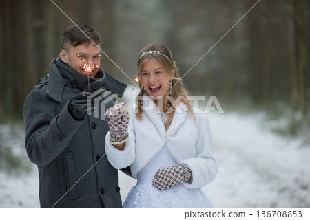 Playful Winter Wedding Moment With Sparklers Playful Winter Wedding Moment With Sparklers 136708853