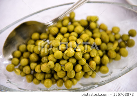 Green Peas In Glass Dish With Spoon Green Peas In Glass Dish With Spoon 136708878