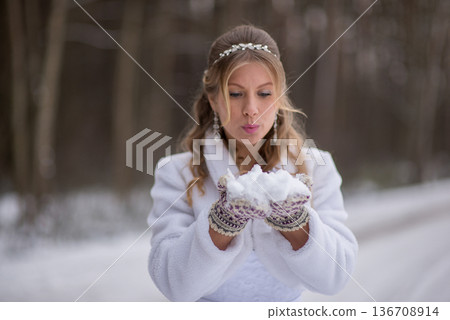 Bride Preparing To Blow Snow Playfully Bride Preparing To Blow Snow Playfully 136708914