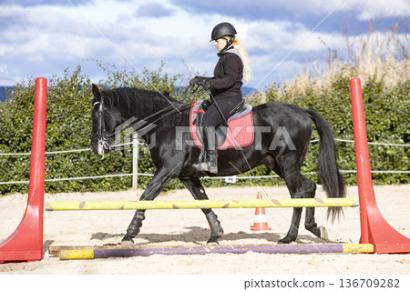 riding girl and horse 136709282