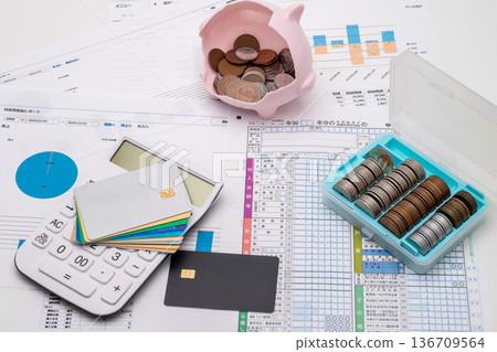 Credit card, tax return documents, calculator and piggy bank Credit card, tax return documents, calculator and piggy bank 136709564